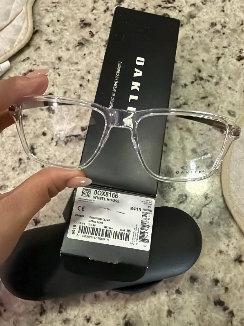 Oakley Clear Frame Glasses with Black Temples and Silver Hinges